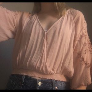 Pink blouse with bell sleeves